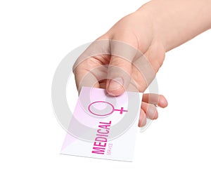 Girl holding medical business card on white, closeup. Women`s health service