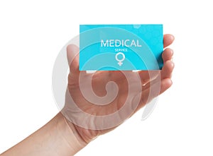 Girl holding medical business card on white, closeup. Women`s health service