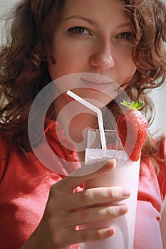 Girl holding milkshake