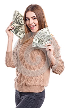 Girl holding money fan at face on white background