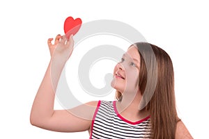 Girl holding a paper heart in hand