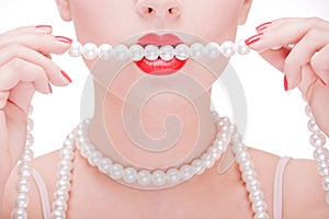 Girl holding pearl necklace photo