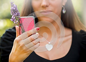 The girl holding the phone