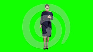 Girl is holding the phone dials the message and paces. Green screen