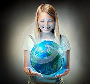 Girl holding the Planet Earth