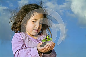 Girl holding plant