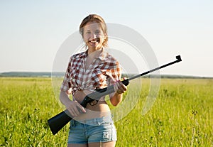 Girl holding pneumatic air rifle