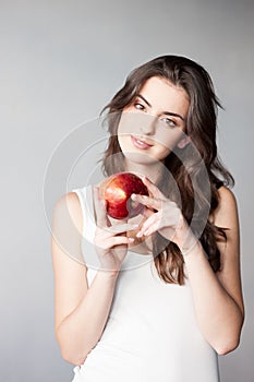 Girl holding red apple