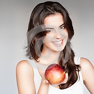 Girl holding red apple