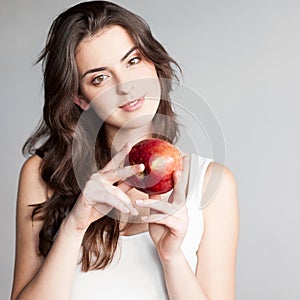 Girl holding red apple