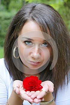Girl holding a red rose