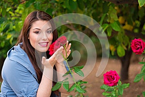 Girl holding red roses