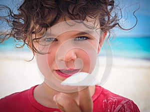 Girl holding shell