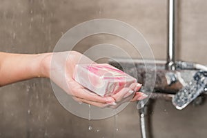 Girl holding soap in hand