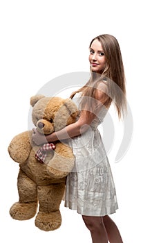 Girl holding soft toy bear