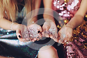 Girl holding sparkles