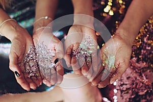 Girl holding sparkles