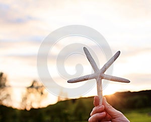 Girl holding a starfish
