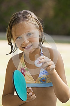 Girl holding table tennis paddle