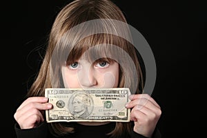 Girl holding ten dollar bill