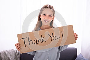 Girl Holding Thank You Placard