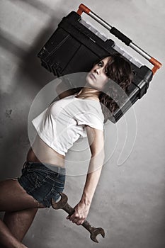 girl holding toolbox and wrench spanner