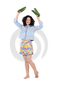 Girl holding two cucumbers