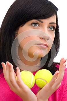 Girl holding two tennis balls