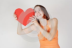 Girl holding valentine heart card