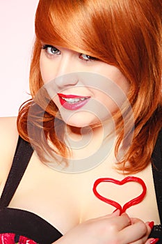 Girl holding valentine red heart love symbol. Valentines day.