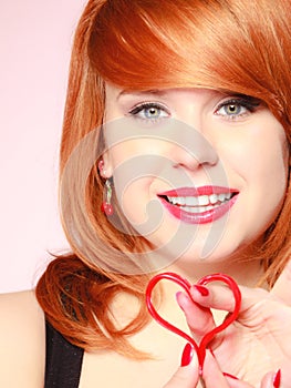 Girl holding valentine red heart love symbol. Valentines day.