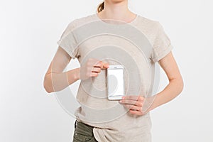 Girl holding white phone. Cellphone isolated on white clipping path inside. Online shopping. Top view.Mock up.Copy space.Template.