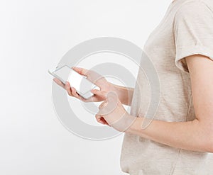 Girl holding white phone. Cellphone isolated on white clipping path inside. Online shopping. Top view.Mock up.Copy space.Template.