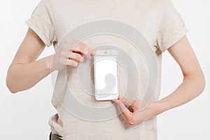 Girl holding white phone. Cellular isolated on white clipping path inside. Top view.Mock up.Copy space.Template.Blank.