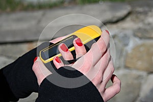 Girl holding yellow GPS navigation