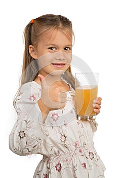 Girl Holdng Glass With Apple Juice Showing Thumb Up