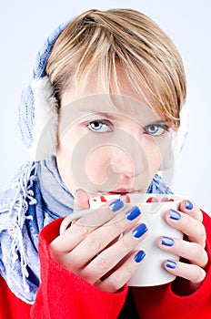 Girl holds cup of hot chocolate. Image has clippin