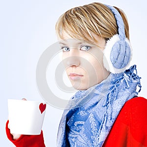 Girl holds cup of tea. Image has clipping path.