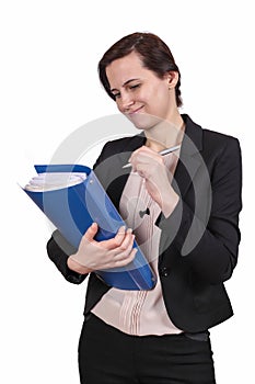 The girl holds documents and a pen in hand