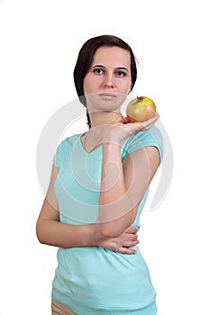 The girl holds in hand apple about the person