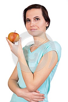 The girl holds in hand apple about the person