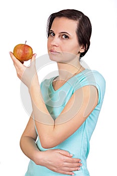 The girl holds in hand apple about the person