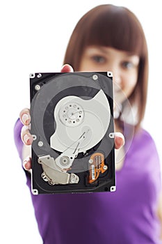 A girl holds a hard disk