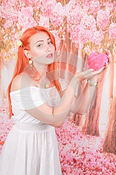 Girl holds Heart shape red fluffy soft pillow for Valentine`s day love