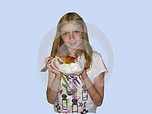 Girl holds her big piece of pie