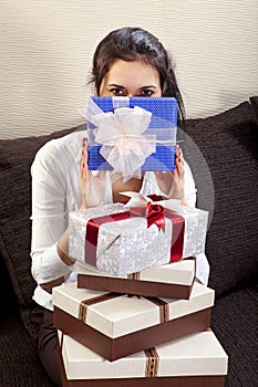 Girl holds one of the many gift boxes