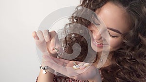 The girl holds sweet donuts in her hands, regretting that she can`t eat them