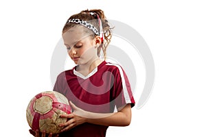 Girl Holidng a Soccer Ball Looking Down
