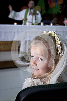 Girl in holy communion dress and veil