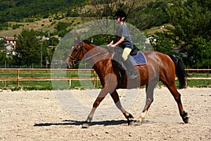 Girl horse riding photo